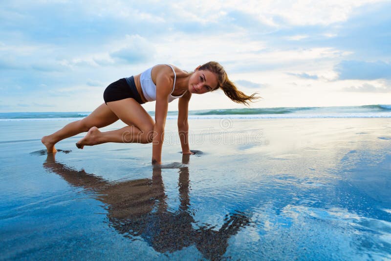 Sporty woman doing mountain climber exercise - run in plank position stock photos Sporty woman doing mountain climber exercise - run in plank position stock photos