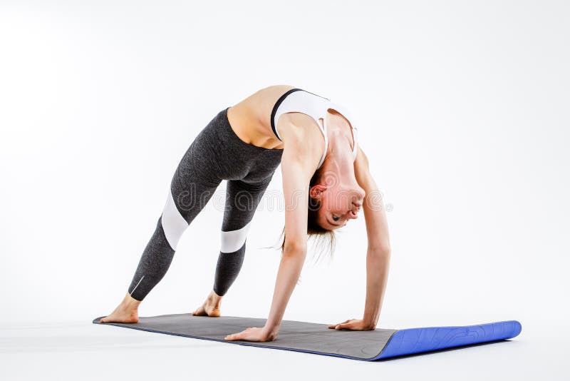 Sporty woman doing stretching exercise royalty free stock photography