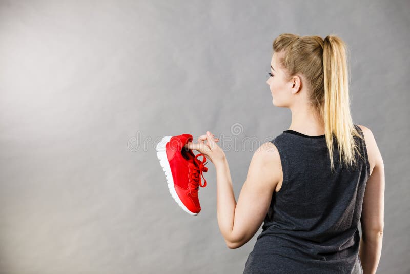 Woman Presenting Sportswear Trainers Shoes Stock Image - Image of ...