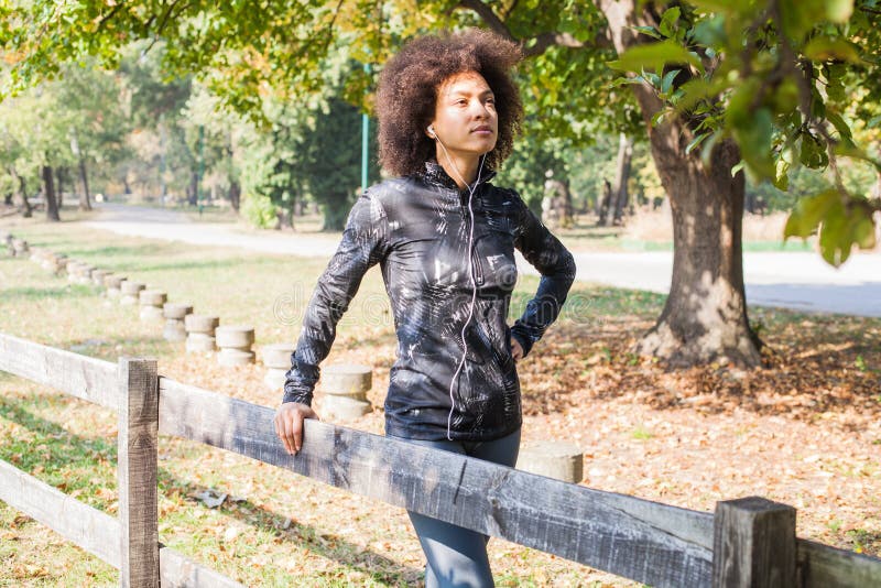 Sporty Woman Relax After Training Listening Music At Park stock images Sporty Woman Relax After Training Listening Music At Park stock images