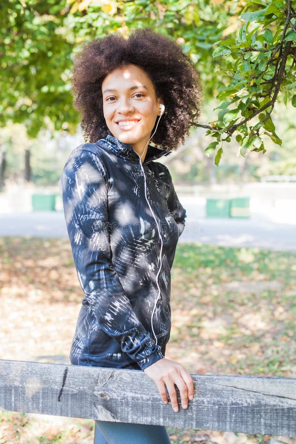 Sporty Woman Relax After Training Listening Music At Park royalty free stock images Sporty Woman Relax After Training Listening Music At Park royalty free stock images