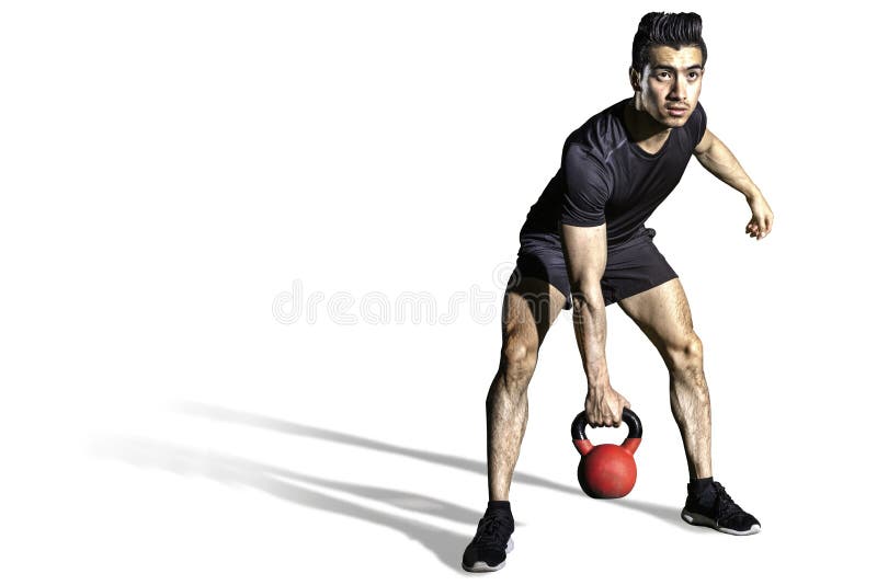 Sporty young man training with kettlebell