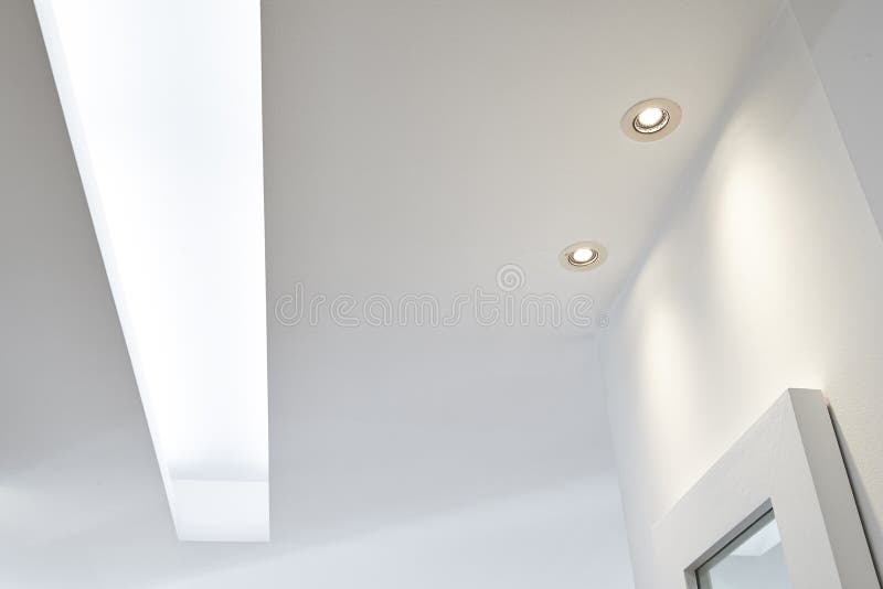 Spot light illuminated on white ceiling stock images