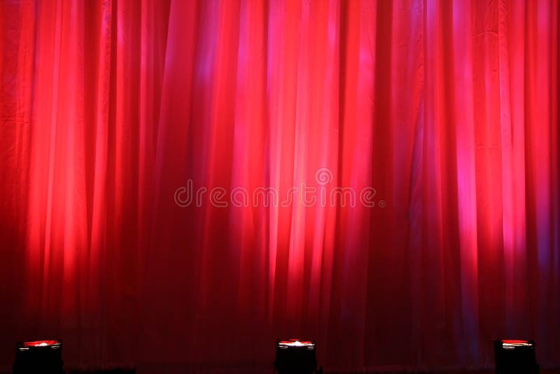 Spot lights on red curtain