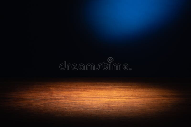 Spotlight on Wooden Board Table Top and Blue Background. Spotlight