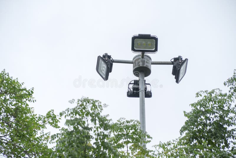 Spotlights in the Park with Trees. Stock Photo Image of bright, power