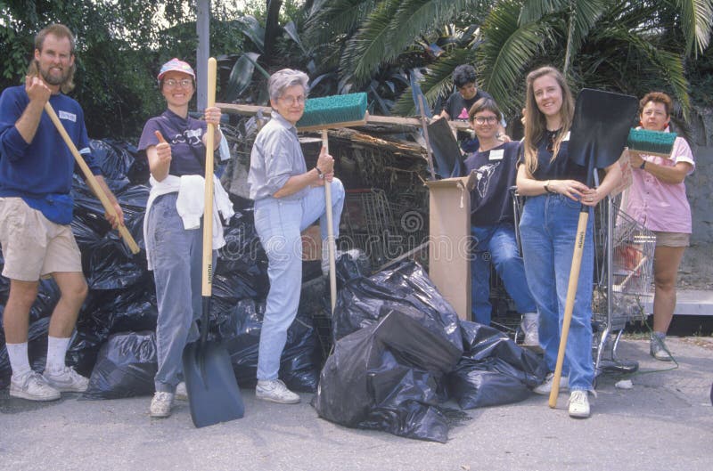 A group of community people clean up the river on Earth Day. A group of community people clean up the river on Earth Day