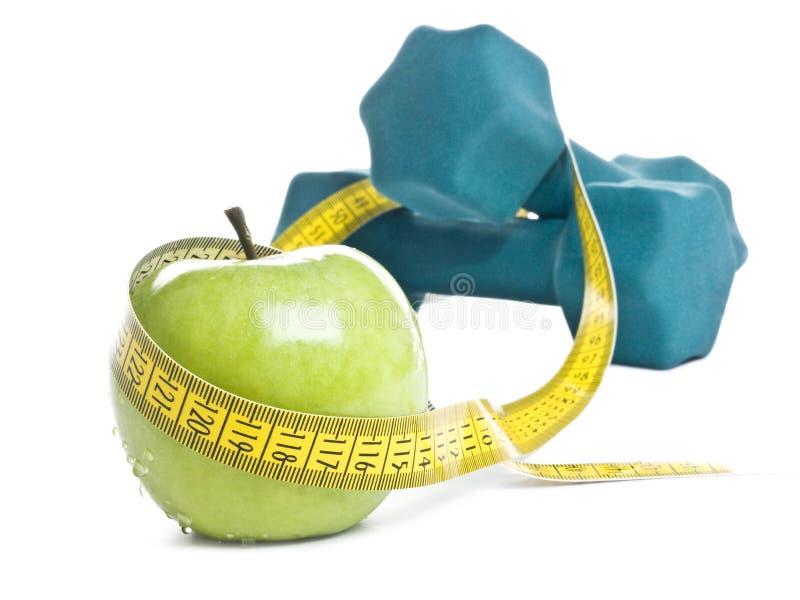 Fitness concept with apple and dumbbells. Fitness concept with apple and dumbbells