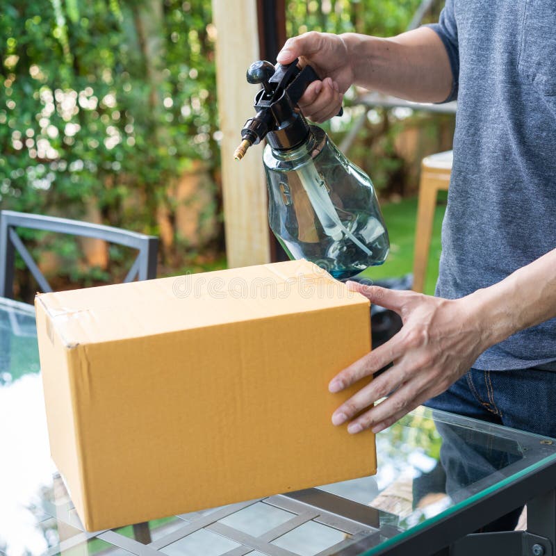 Spray Disinfectant Chemicals on Cardboard Boxes To Prevent the ...