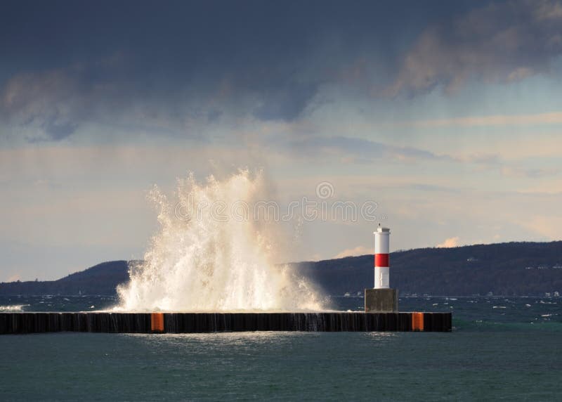 Spray over breakwall stock photos