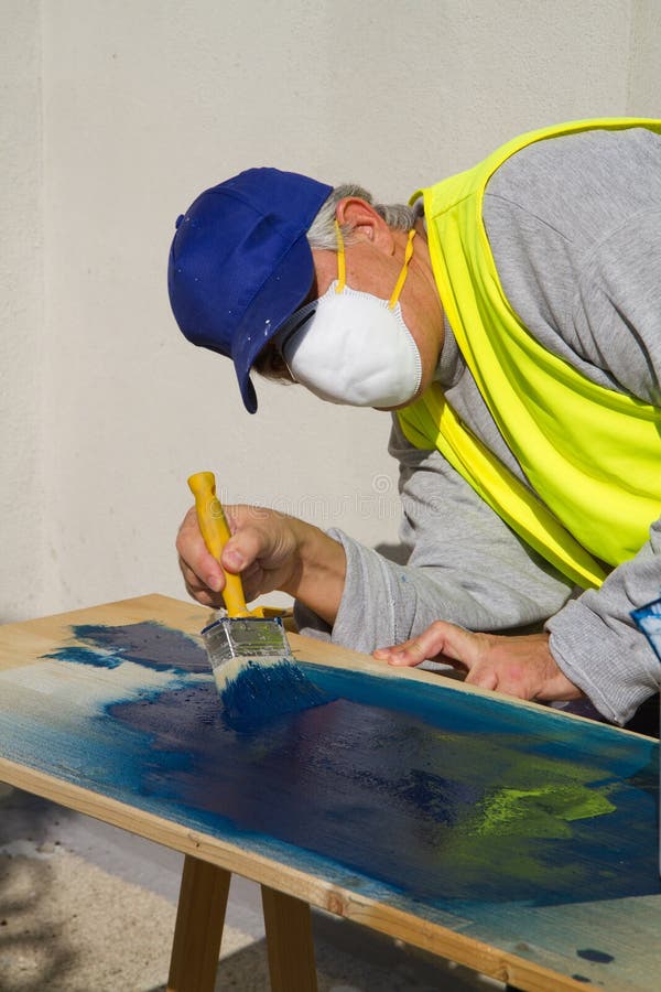 Spray painter stock photo. Image of outside, refinish 69399500