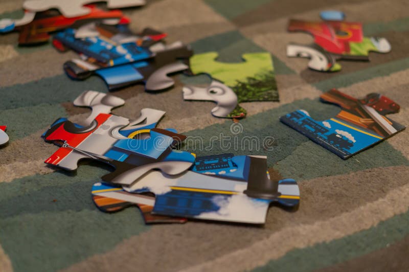 Parts of a child puzzle on floor