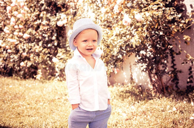 Spring kids portrait. Closeup face of cute smiling spring child. Kid emotions concept. Portrait of young laughing boy stock images