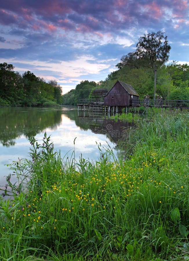 Spring landscape with watermill