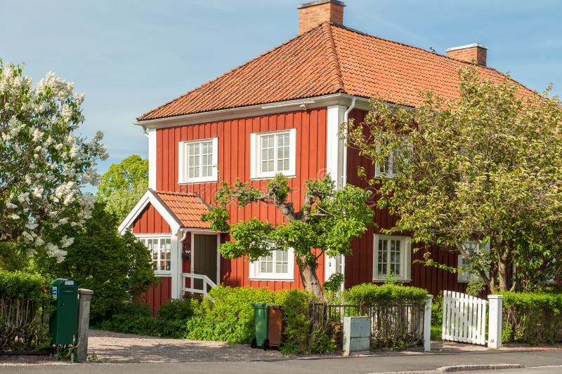 Norrkoping, Sweden - May 21, 2011: Röda stan or Red city during spring in Norrkoping. This is a picturesque residential area with old red wooden houses in Norrkoping, which is a historic industrial town. Norrkoping, Sweden - May 21, 2011: Röda stan or Red city during spring in Norrkoping. This is a picturesque residential area with old red wooden houses in Norrkoping, which is a historic industrial town.