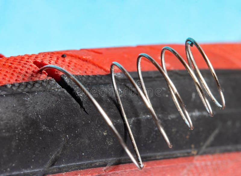 The Spring Protrudes from a Crack in the Tire of the Bicycle Stock Image Image of detail