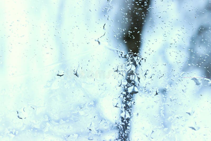 Spring. It`s snowing and raining outside. The machine is photographed inside the machine. Background is blurred. royalty free stock photography Spring. It`s snowing and raining outside. The machine is photographed inside the machine. Background is blurred. royalty free stock photography