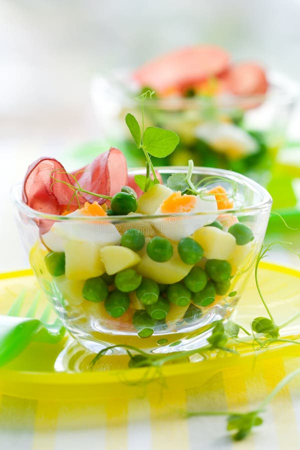 Spring salad with potato,egg, pea and ham