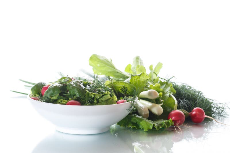 Spring salad from early vegetables, lettuce leaves, radishes and herbs