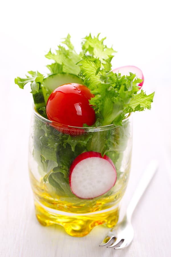Spring salad with tomato, cucumber and radish stock image