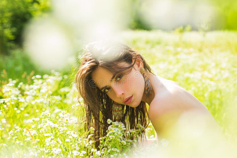 Spring Sexy Girl. Sensual Spring Young Woman Outdoors Enjoying Nature. Smiling Young Woman in Green Grass. Spring Meadow