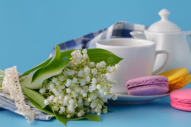 Spring Tea Drinking with White Flowers on Blue Background Stock Image