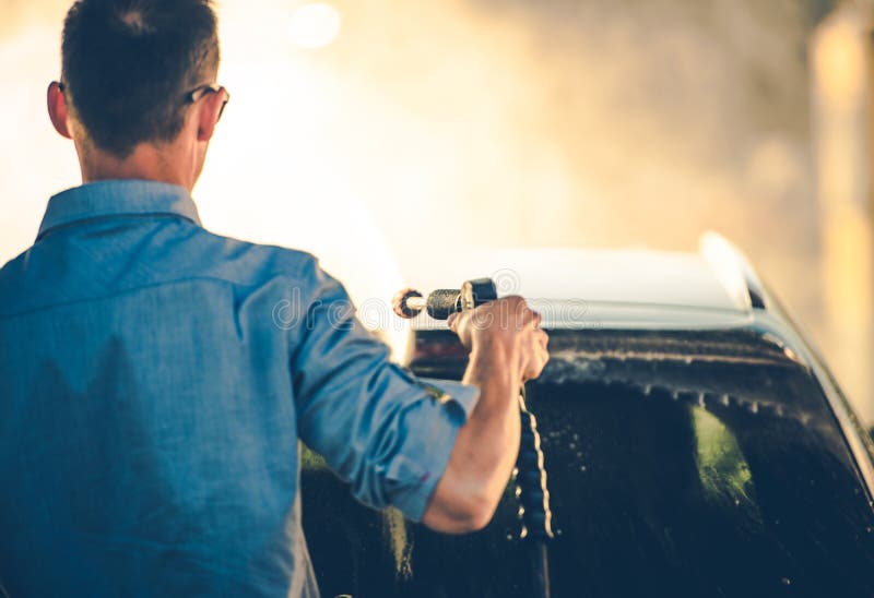Spring Time Car Washing Using Pressure Washer stock image Spring Time Car Washing Using Pressure Washer stock image