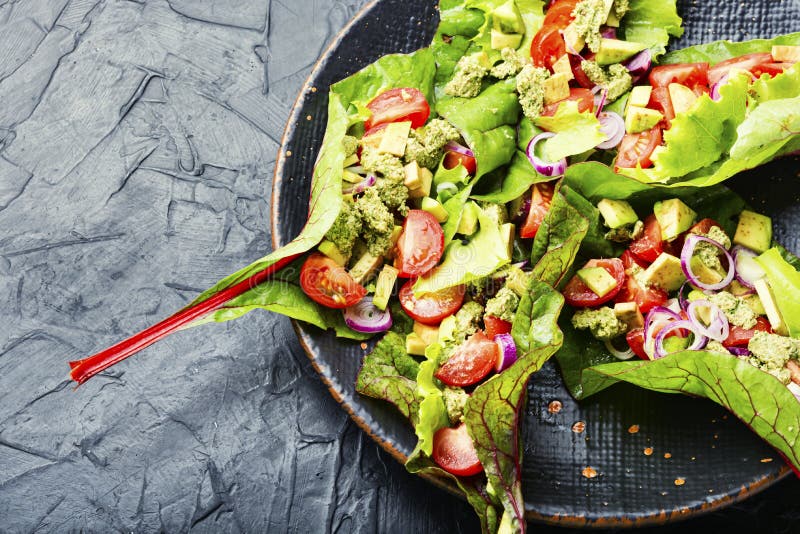 Spring vegetable salad in chard leaves