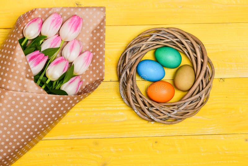 Spring Vibes. Colorful Eggs and Bouquet Fresh Tulip Flowers on Yellow ...