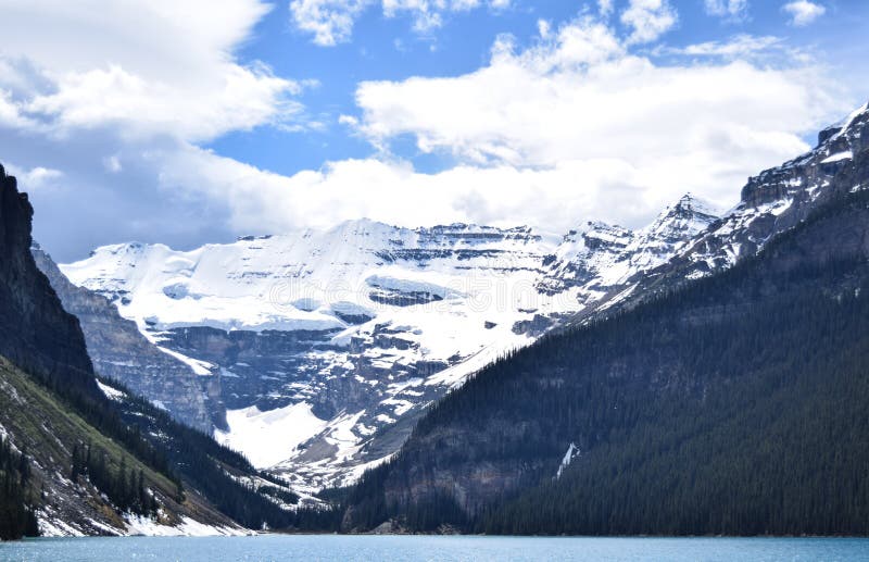 Storm Clouds Build Behind a Slushy Lake Louise, Alberta Stock Photo - Image  of majestic, glacier: 115348288