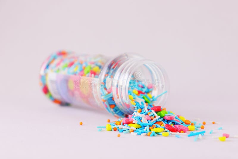 Sprinkle for Easter Cakes Scattered from a Can on a White Surface Stock