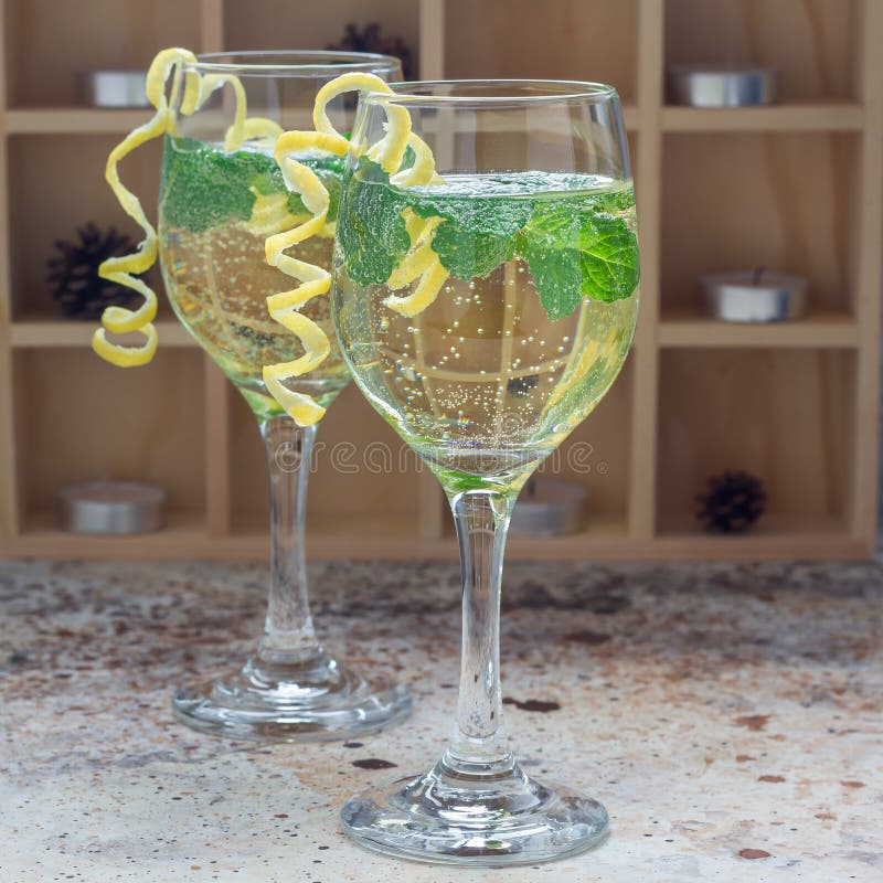 Spritzer Cocktail with White Wine, Mint and Ice, Decorated with Spiral