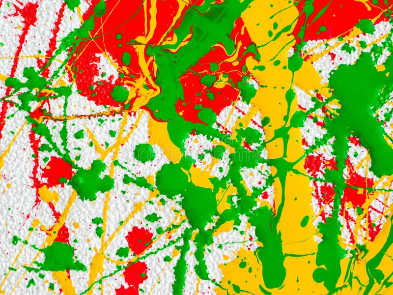 Splashes of red and yellow green paint on a white background. expressionism. Splashes of red and yellow green paint on a white background. expressionism