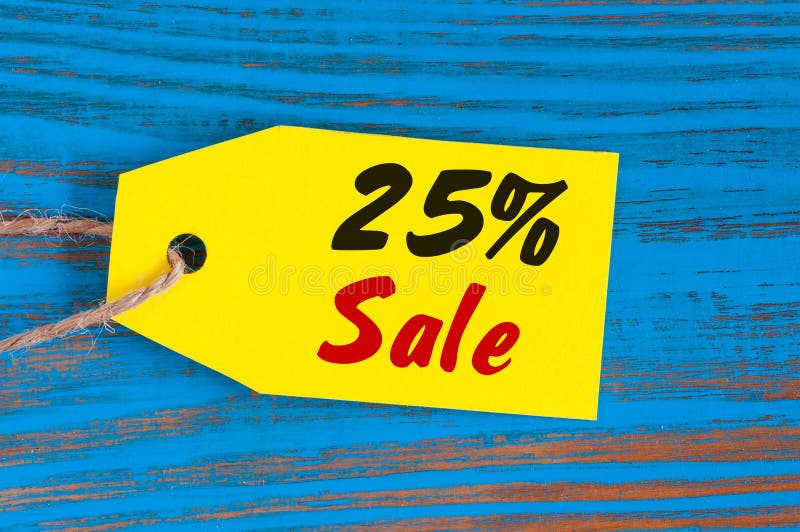 Sale minus 25 percent. Big sales twenty five percents on blue wooden background for flyer, poster, shopping, sign, discount, marketing, selling, banner, web. Sale minus 25 percent. Big sales twenty five percents on blue wooden background for flyer, poster, shopping, sign, discount, marketing, selling, banner, web