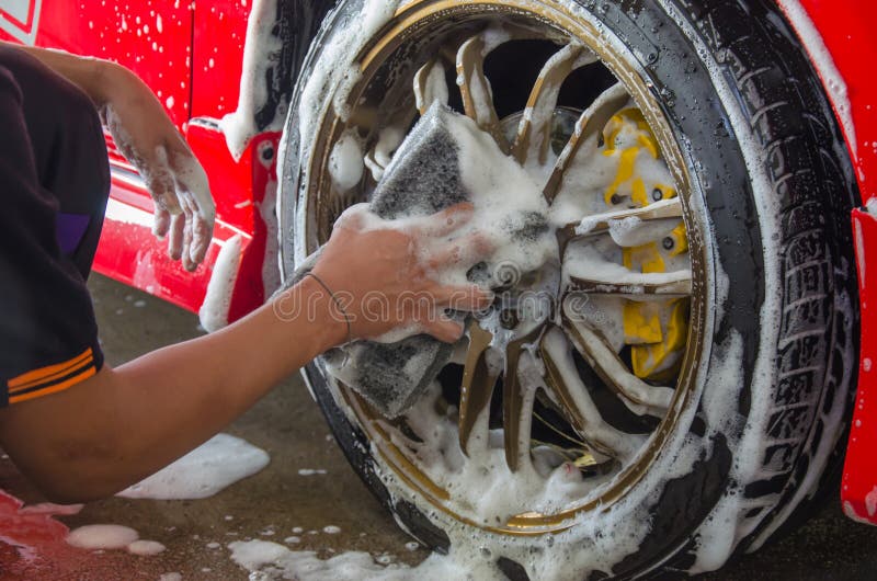 Spugna dell'autolavaggio della mano fotografia stock Spugna dell'autolavaggio della mano fotografia stock