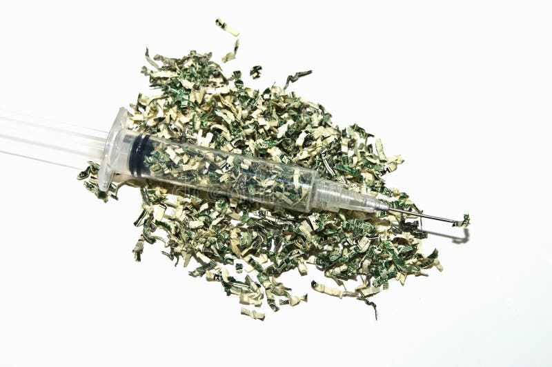 Shredded money with a syringe full. Concept or metaphor for cost of drugs, health, wasting money on drugs, medical plans, etc. Shredded money with a syringe full. Concept or metaphor for cost of drugs, health, wasting money on drugs, medical plans, etc.