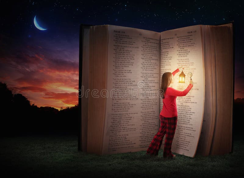 A woman studying the Bible late at night. A woman studying the Bible late at night.