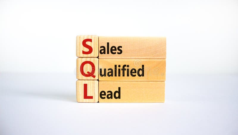 SQL sales qualified lead symbol. Wooden blocks with words `SQL sales qualified lead`. Beautiful white background. Business and S stock photography