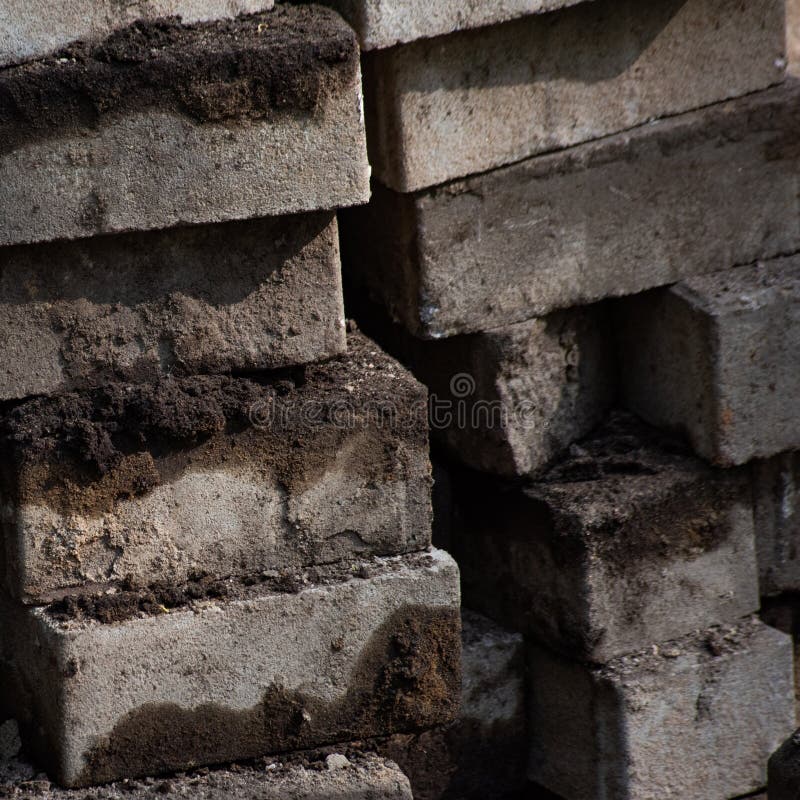 Square background with pile of dirty rectangular paving stones royalty free stock photography