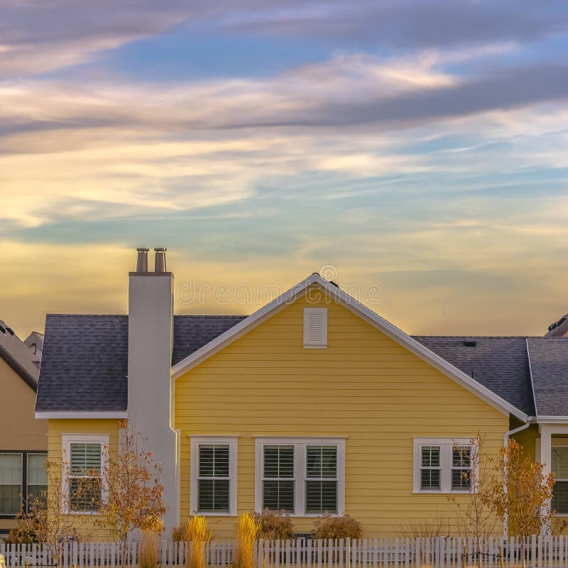 Exterior of a Single Storey Home with Yellow Wall and Dark Gray Roof Stock  Image - Image of outdoor, fence: 148792765