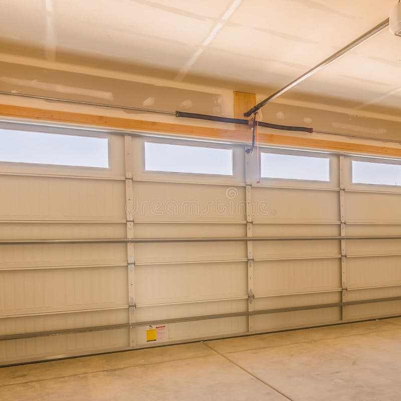 Interior Of An Unfinished Garage With Unpainted Walls And Ceiling