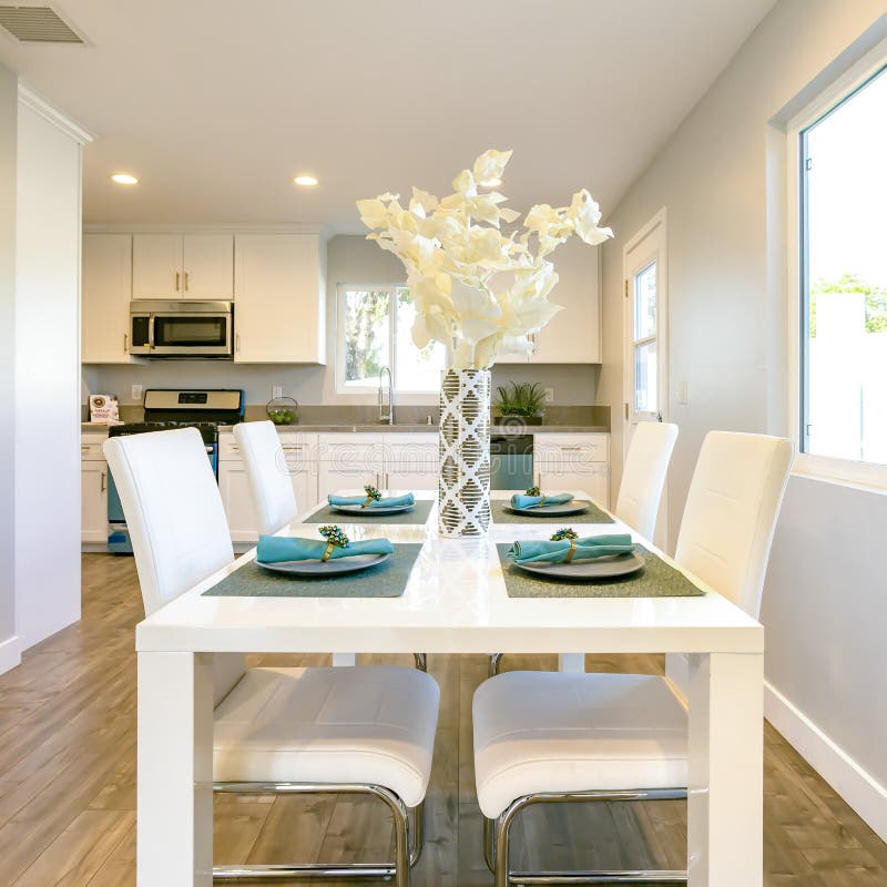 Square Kitchen Table with All Chairs Pushed in Stock Photo Image of