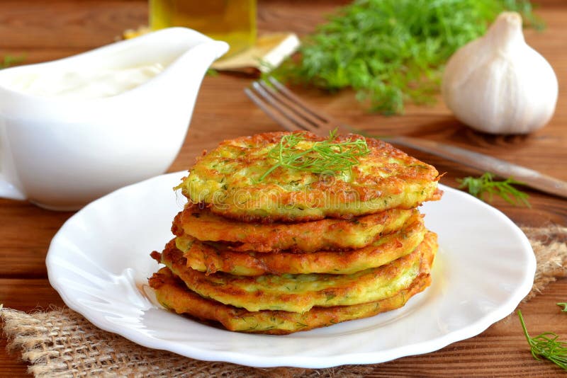 Squash delicious fried pancake with dill.