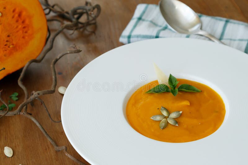 Squash Soup in a Plate with Basil Leaf Stock Image Image of heat