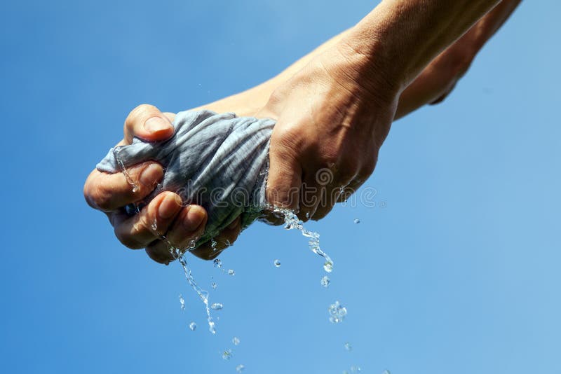 Squeezing of cloth. stock photo. Image of summer, towel 58710984