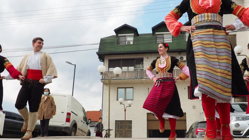 Sremska Mitrovica, Serbia, 02.19.22 Girls boys in traditional Serbian Balkan costumes dance Kolo Kolov. A circle dance