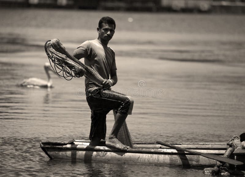 Sri Lankan Canoe Fisherman Looking at Viewer Editorial Stock Image