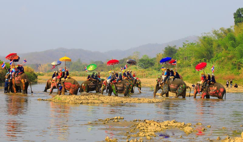 Srisatchanalai Province,Thailand-April 7,2019 ,Many people celebrate in Thai old culture. On Hadsoiy village, Man go into the monkshood on the elephant cross stock photos Srisatchanalai Province,Thailand-April 7,2019 ,Many people celebrate in Thai old culture. On Hadsoiy village, Man go into the monkshood on the elephant cross stock photos