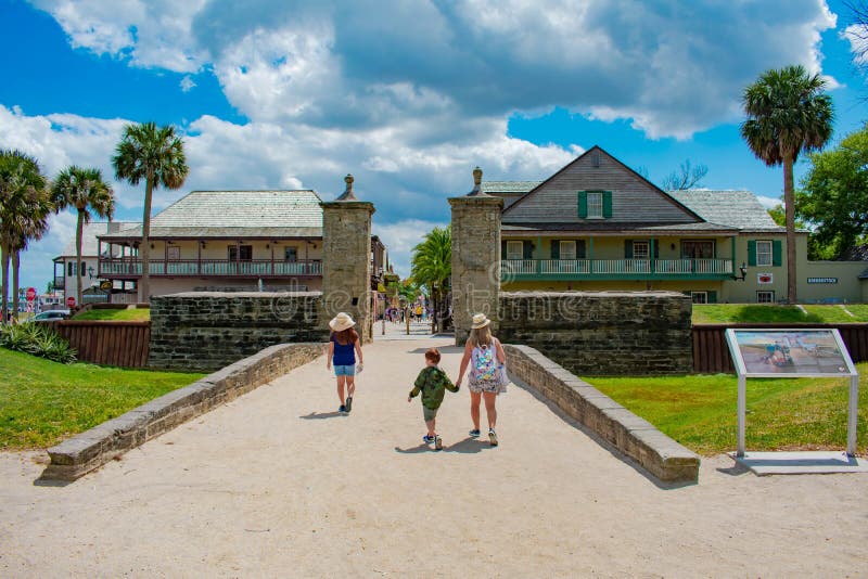 Family walking in Old City Gate at on St. George street in Florida`s Historic Coast 2 royalty free stock photos Family walking in Old City Gate at on St. George street in Florida`s Historic Coast 2 royalty free stock photos