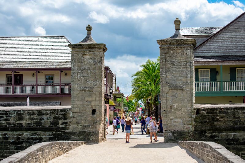 Family walking in Old City Gate at on St. George street in Florida`s Historic Coast 1 stock photo Family walking in Old City Gate at on St. George street in Florida`s Historic Coast 1 stock photo